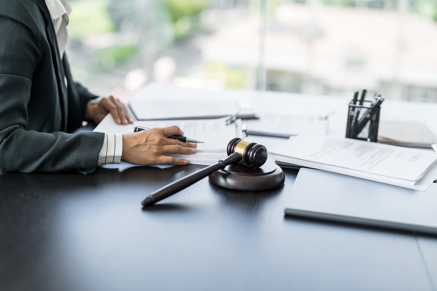 Lawyer,Businessman,Working,With,Lawbook,In,Office,Or,Courtroom,Legal